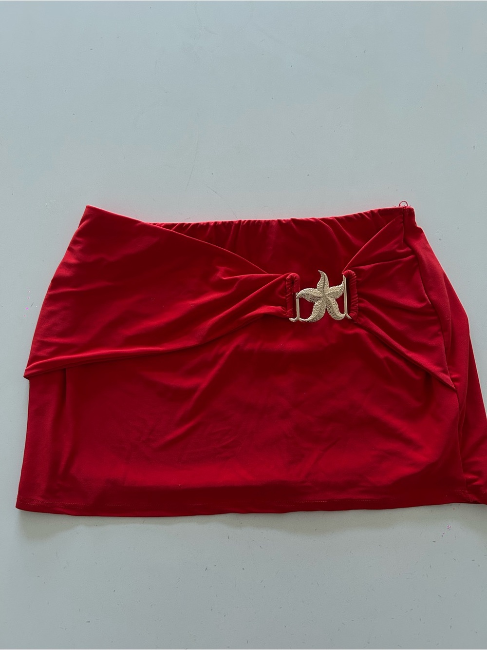 Cherry red mini skirt w/ gold starfish detail